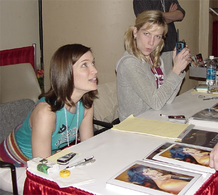 MegaCon 2003  Louise W answering a question, while her Zentelliness mugs for the camera
